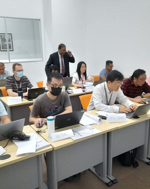 Franklin Styne delivering hands-on AI training to a corporate team in a classroom setting